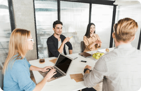 Some people sat around a meeting table